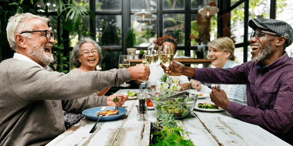 A group of seniors celebrating retirement at a dinner table