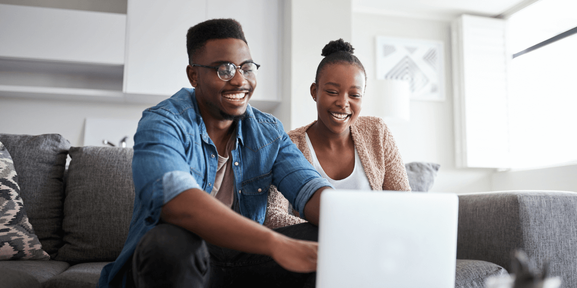 Young couple reviewing their financial options on their laptop