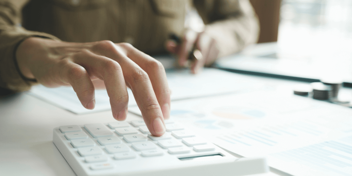 woman calculating their financial goals and determining what accounts to open