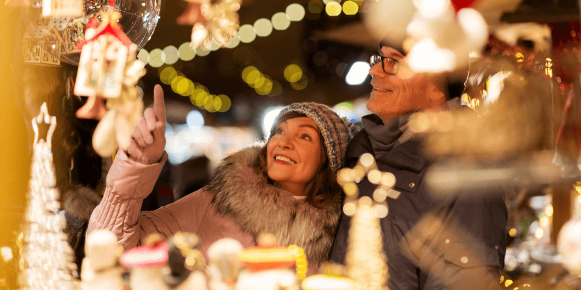 Happy couple window shopping for holiday decorations