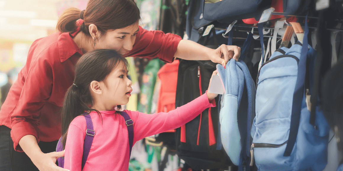 Mother and daughter shopping for backpacks